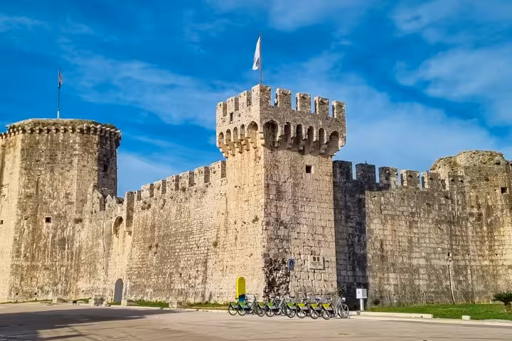 Kamerlengo Castle medieval fortress walls and towers in Trogir, Croatia under blue sky