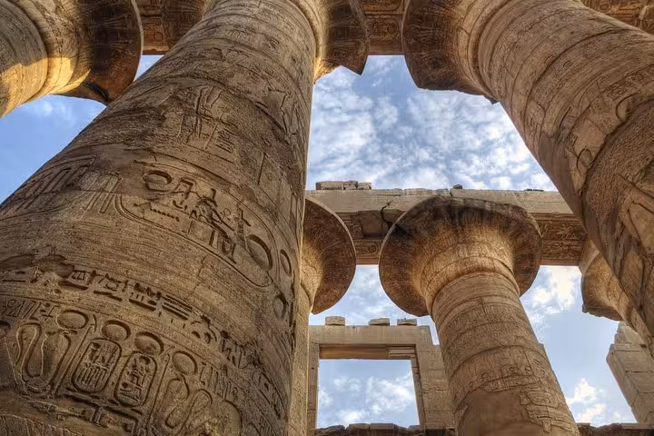 Close-up of Karnak Temple columns with hieroglyphs, highlight of private Hurghada to Luxor day trip with guide