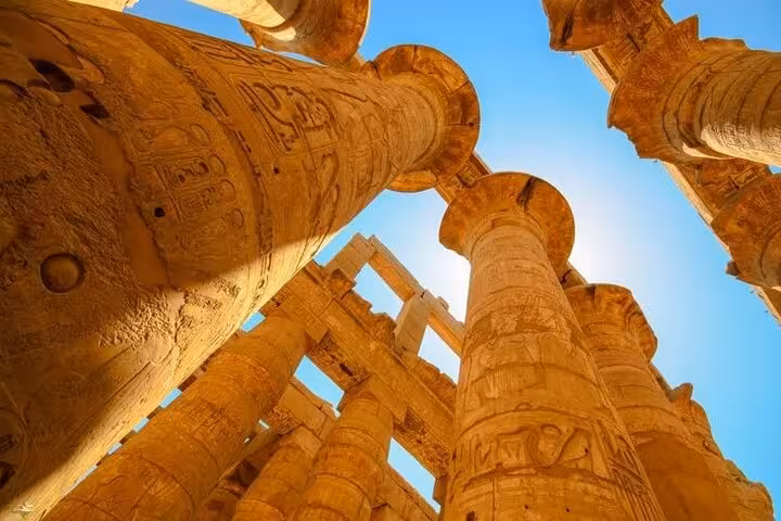 Karnak Temple columns with hieroglyphs in Luxor, seen on comfort day trip from Hurghada with guide