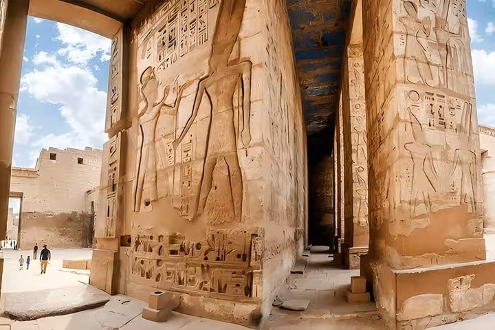 Karnak Temple columns with ancient hieroglyphs in Luxor, Egypt on Hurghada day tour with lunch and guide
