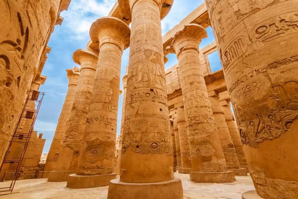 Towering carved columns inside Karnak Temple, Luxor stop on Cleopatra’s Egypt Cairo to Nile cruise itinerary