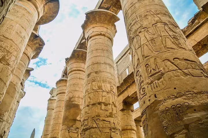 Close-up of carved columns at Karnak Temple on Hurghada to Luxor tour, including Valley of the Kings and Tutankhamun tomb
