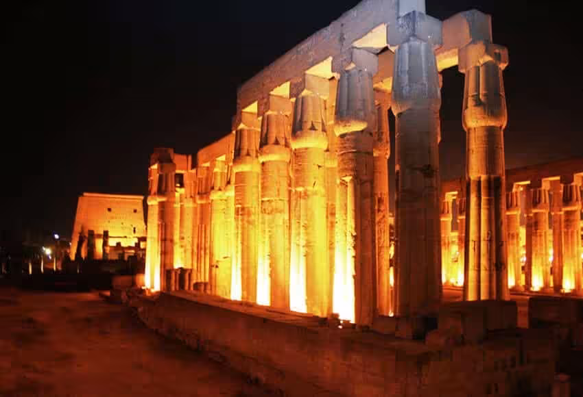 Illuminated columns of Karnak Temple at night in Luxor, Egypt, perfect for an evening sightseeing trip