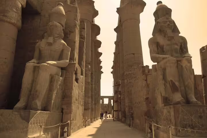 Karnak Temple entrance with colossal pharaoh statues, Luxor day tour by plane from Sharm El Sheikh