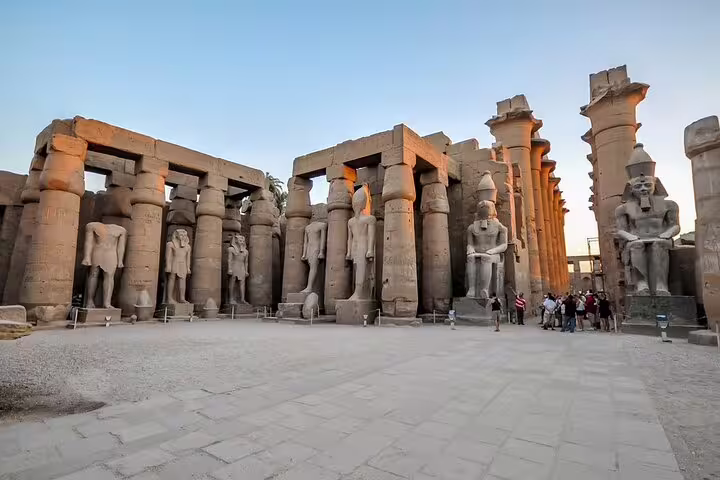 Karnak Temple courtyard with colossal statues and columns, Luxor day tour by plane from Sharm El Sheikh