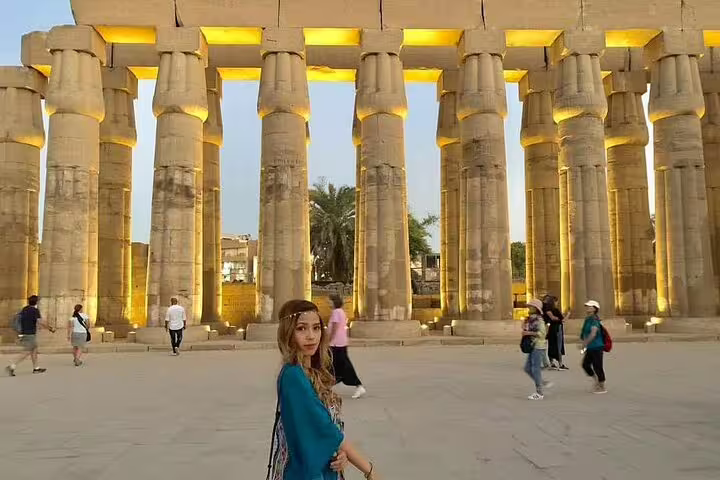 Traveler at Karnak Temple colonnade, Luxor day trip by flight from Cairo on a private guided tour