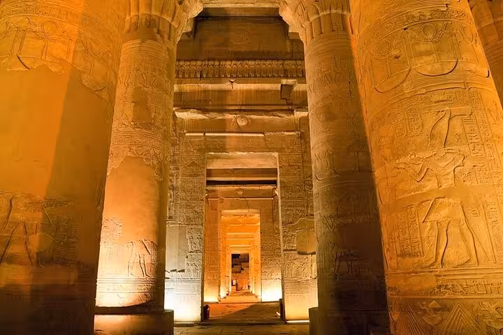 Illuminated Karnak Temple hypostyle hall columns in Luxor, highlight of 8-day Egypt tour package