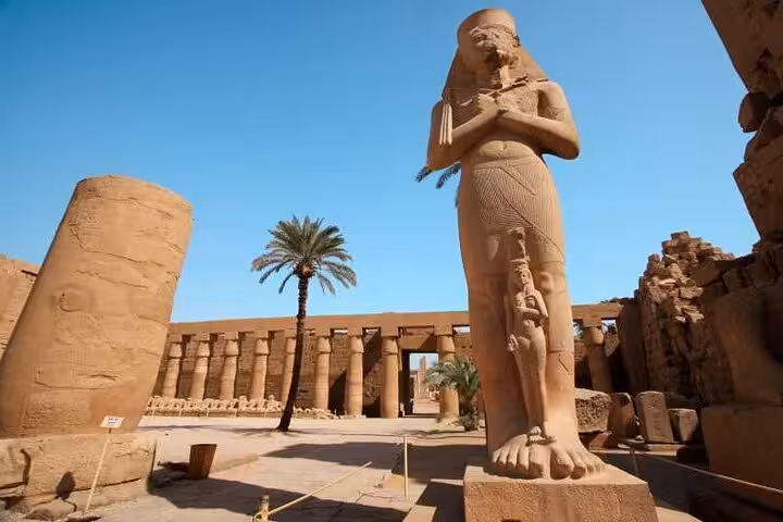 Colossal Karnak Temple statue and columns in Luxor, visited on a full-day semi-private tour from Hurghada with tickets