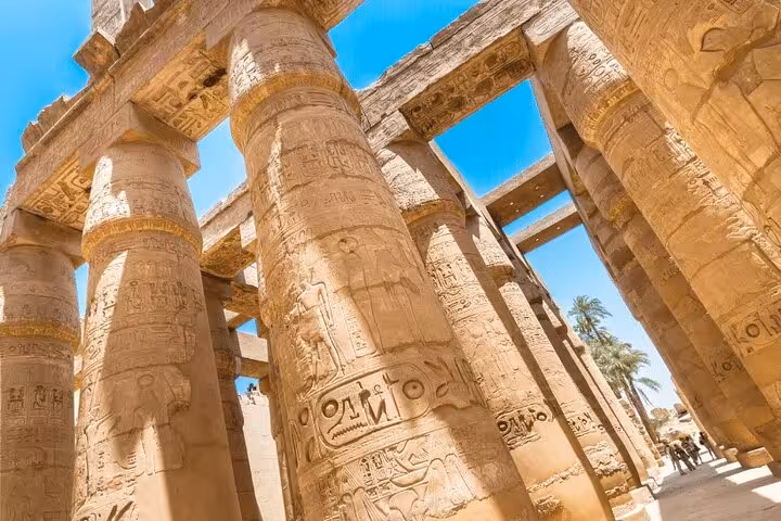 Karnak Temple columns with hieroglyphs in Luxor on private overnight tour from Hurghada with balloon ride
