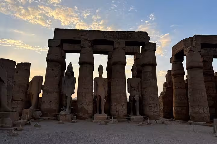 Karnak Temple columns and pharaoh statues at sunset on full-day Luxor semi-private tour from Hurghada