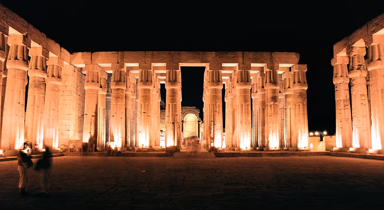 Karnak Temple Luxor illuminated colonnade at night, showcasing the Sound and Light Show experience