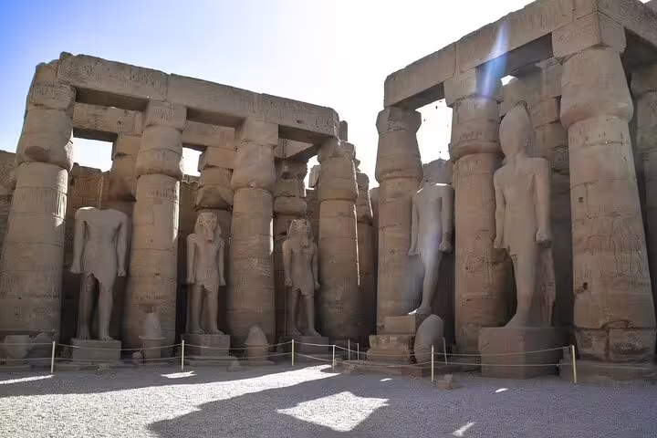 Sunlit Karnak Temple columns and statues, guided sightseeing on 4 nights 5 days Nile cruise from Luxor
