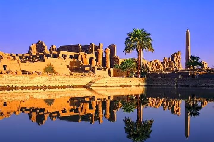 Karnak Temple complex and obelisk reflected on the Nile, highlight of comfort Luxor trip from Hurghada