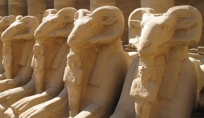 Row of ram-headed sphinx statues lining the Avenue of Sphinxes at Karnak Temple, Luxor