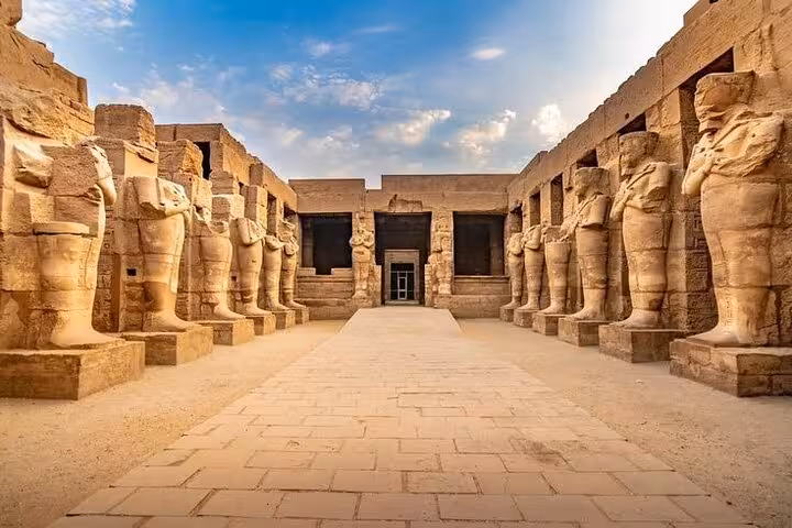 Karnak Temple avenue of ram-headed sphinx statues on a comfort Luxor day trip from Hurghada with guide