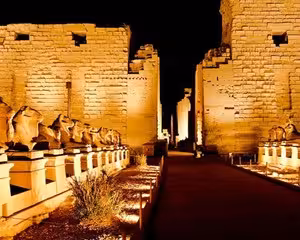 Karnak Temple avenue of sphinxes illuminated at night, Luxor Egypt