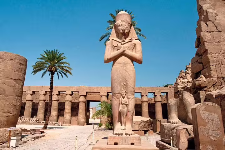 Karnak Temple statue courtyard on Luxor Valley of the Queens day tour by bus from Hurghada, Egypt