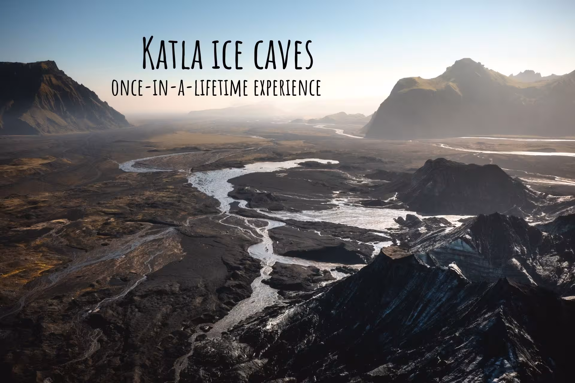 Aerial view of Katla ice caves landscape with braided glacial rivers and volcanic mountains in South Iceland