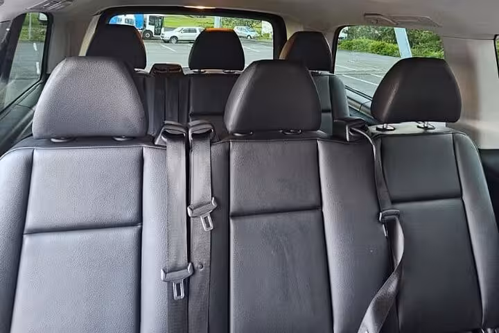 Spacious interior of a private transfer vehicle for Keflavik Airport to Reykjavik route, offering comfortable seating.