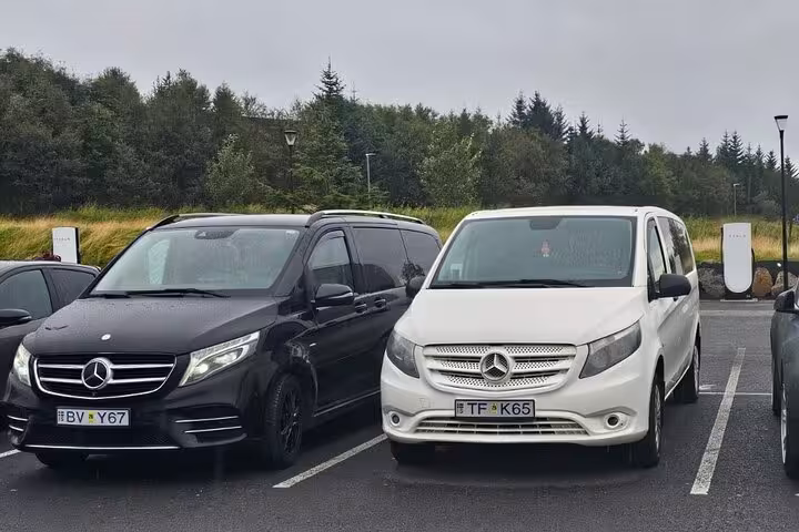 Black and white Mercedes vans ready for Keflavik Airport to Reykjavik private transfer service.