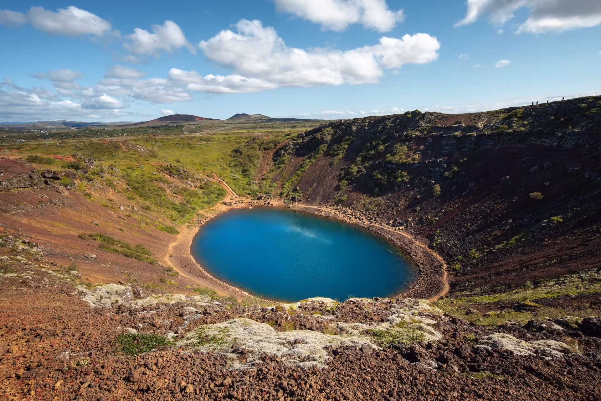 Kerid volcanic crater lake with vivid blue water on Iceland's Golden Circle route