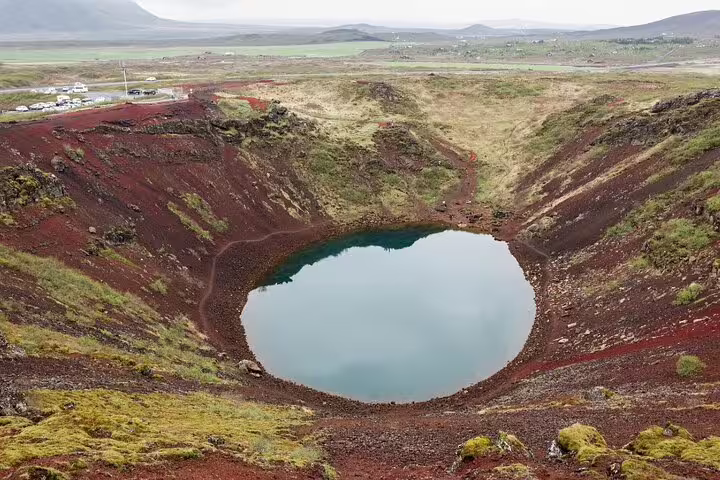 Kerid volcanic crater lake with red lava walls on Iceland's Golden Circle route