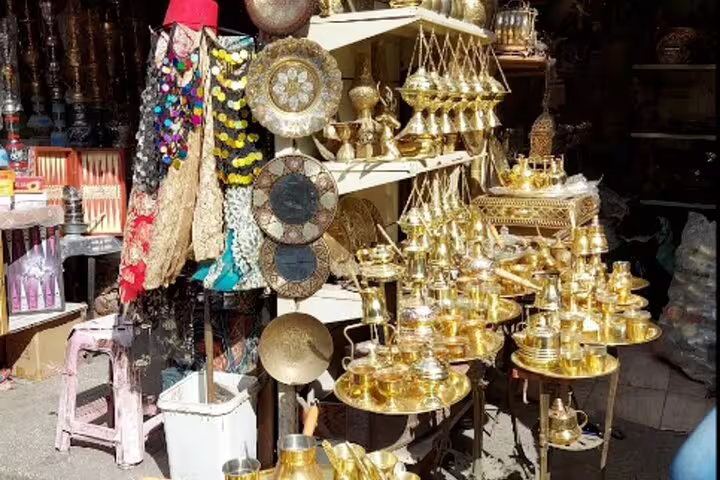 Brass lanterns and souvenirs at Khan El Khalili Bazaar stall, shopping stop on private Old Cairo tour