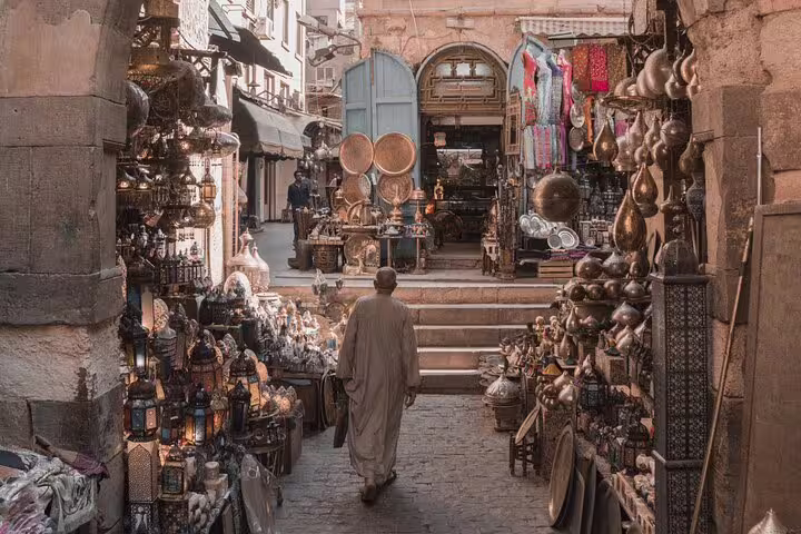 Khan El Khalili bazaar alley in Old Cairo with lanterns and brassware on a Cairo day tour in Egypt