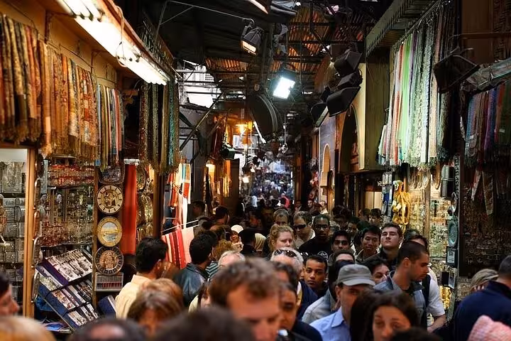 Crowded Khan El Khalili bazaar in Cairo with textiles and souvenirs, stop on 3-day private Egypt tour