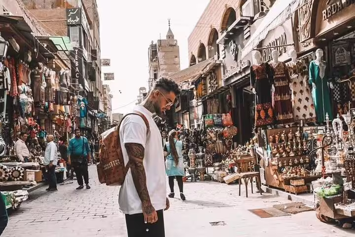 Khan El Khalili bazaar street in Cairo with souvenir stalls, part of Alexandria Port tour to Pyramids and Citadel