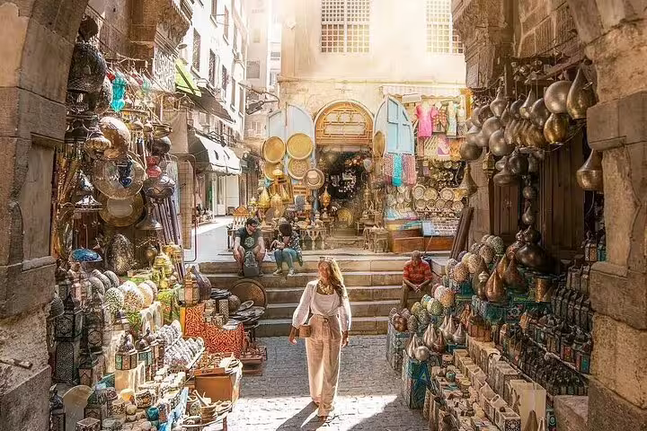 Khan El-Khalili bazaar alley in Cairo with brass lanterns and souvenirs on a guided city tour