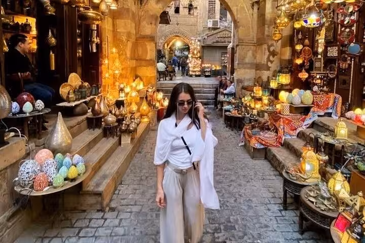 Khan El Khalili bazaar alley with glowing lantern stalls in Islamic Cairo on the Museum Citadel and Khan El Khalili tour