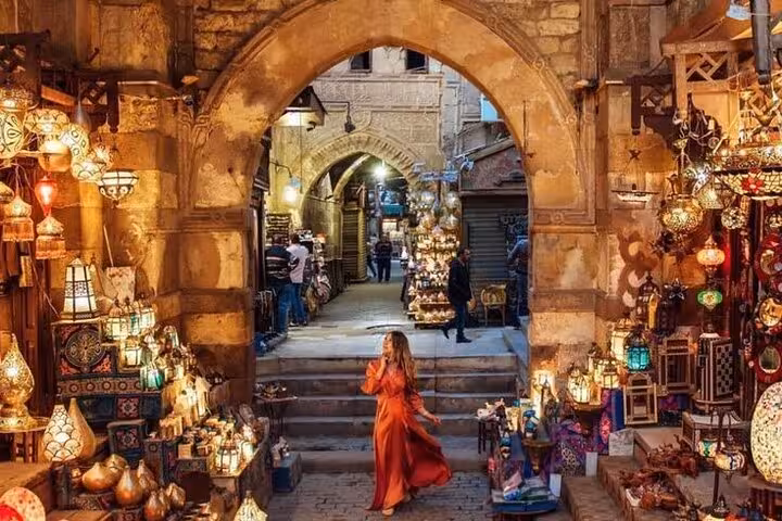 Khan El Khalili bazaar archway glowing with lanterns in Cairo, highlight of Museum and Citadel guided tour