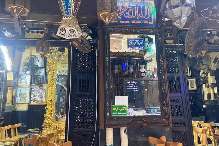 Traditional Khan el Khalili Cairo cafe entrance with lanterns and carved wood, stop on market shopping and Koshary lunch tour