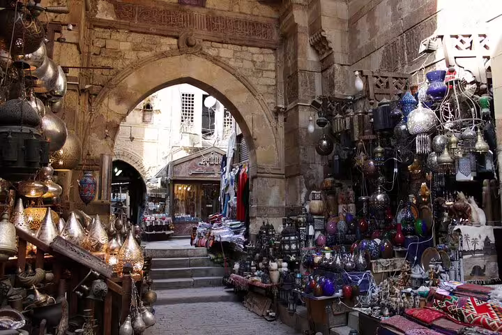 Old Cairo market alley near Khan El Khalili with spices and lamps on a 2-day private guided Cairo tour