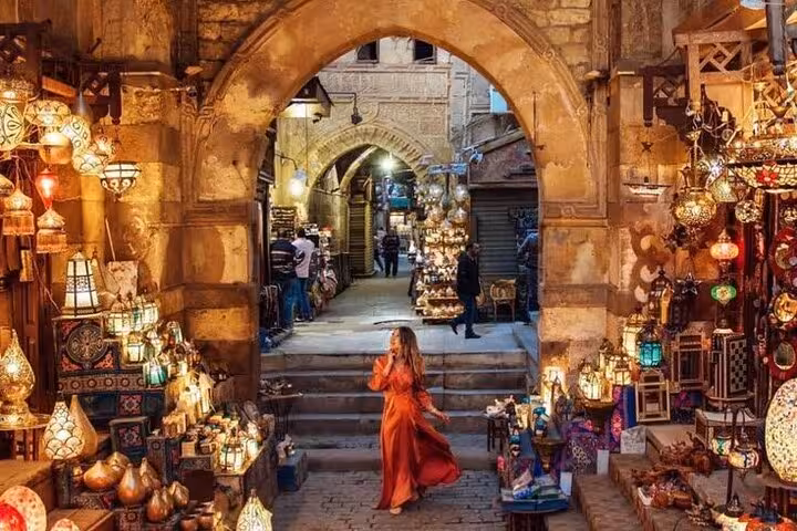 Khan el-Khalili market archway glowing with lanterns, Historic Islamic Cairo walking tour and street food