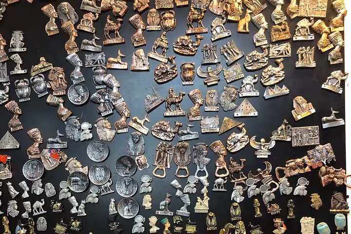 Egyptian souvenir magnets and pharaonic icons at Khan El Khalili market on private Grand Museum tour