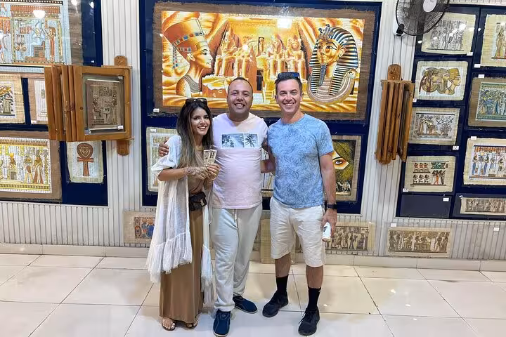 Tourists shopping Egyptian papyrus art at Khan El Khalili bazaar, Cairo experience with Giza Pyramids and felucca