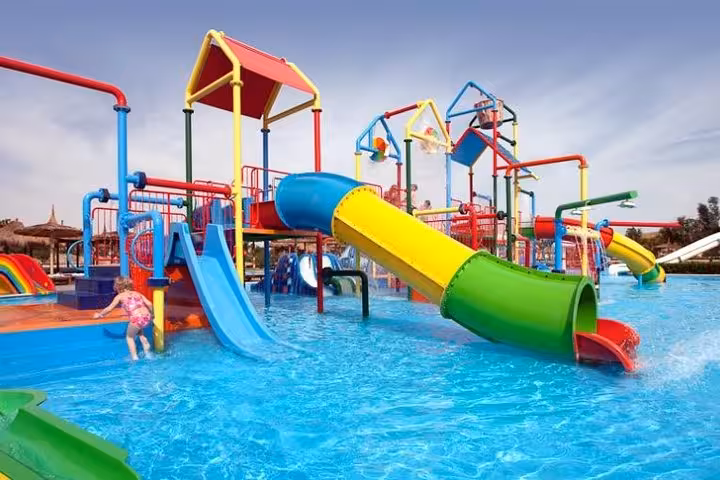 Kids splash zone with colorful slides at Makadi Water World aqua park tour from Hurghada, El Gouna, Makadi Bay
