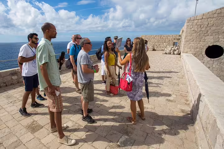 Guide briefing group at Dubrovnik city walls on King’s Landing streets group tour, Game of Thrones filming locations