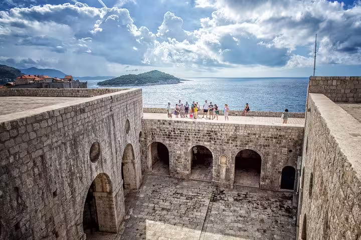 Group on Dubrovnik city walls overlooking the Adriatic, King's Landing Iron Throne Game of Thrones tour stop