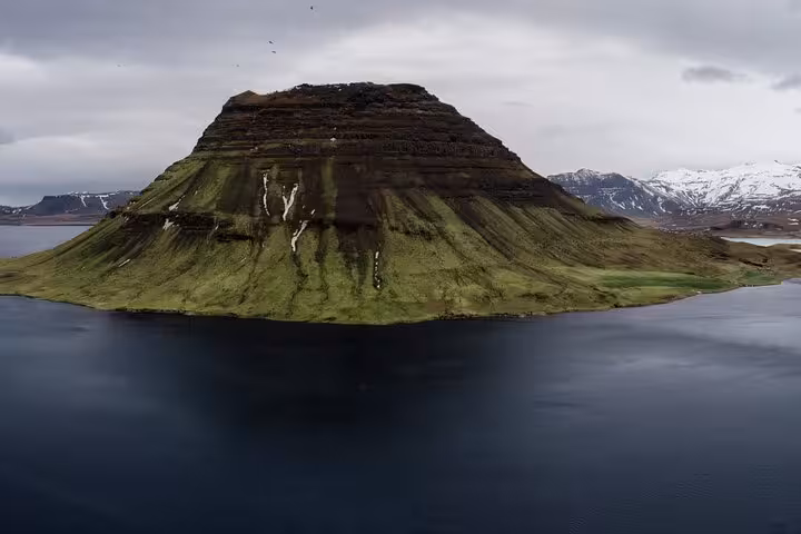 Kirkjufell mountain rising from the fjord on Snaefellsnes Peninsula, West Iceland