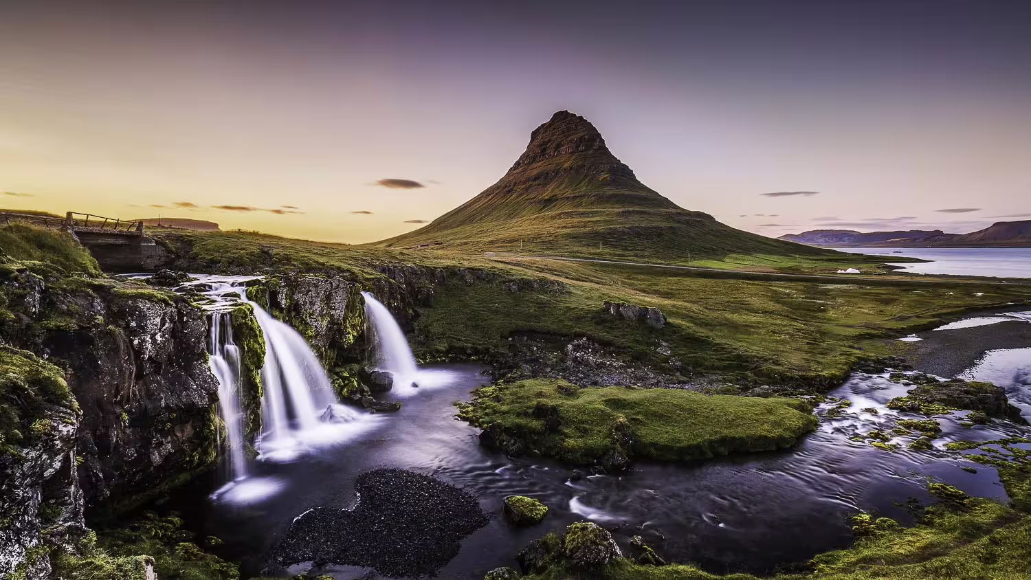 Kirkjufellsfoss waterfall with Kirkjufell mountain at sunset on Snaefellsnes Peninsula, Iceland