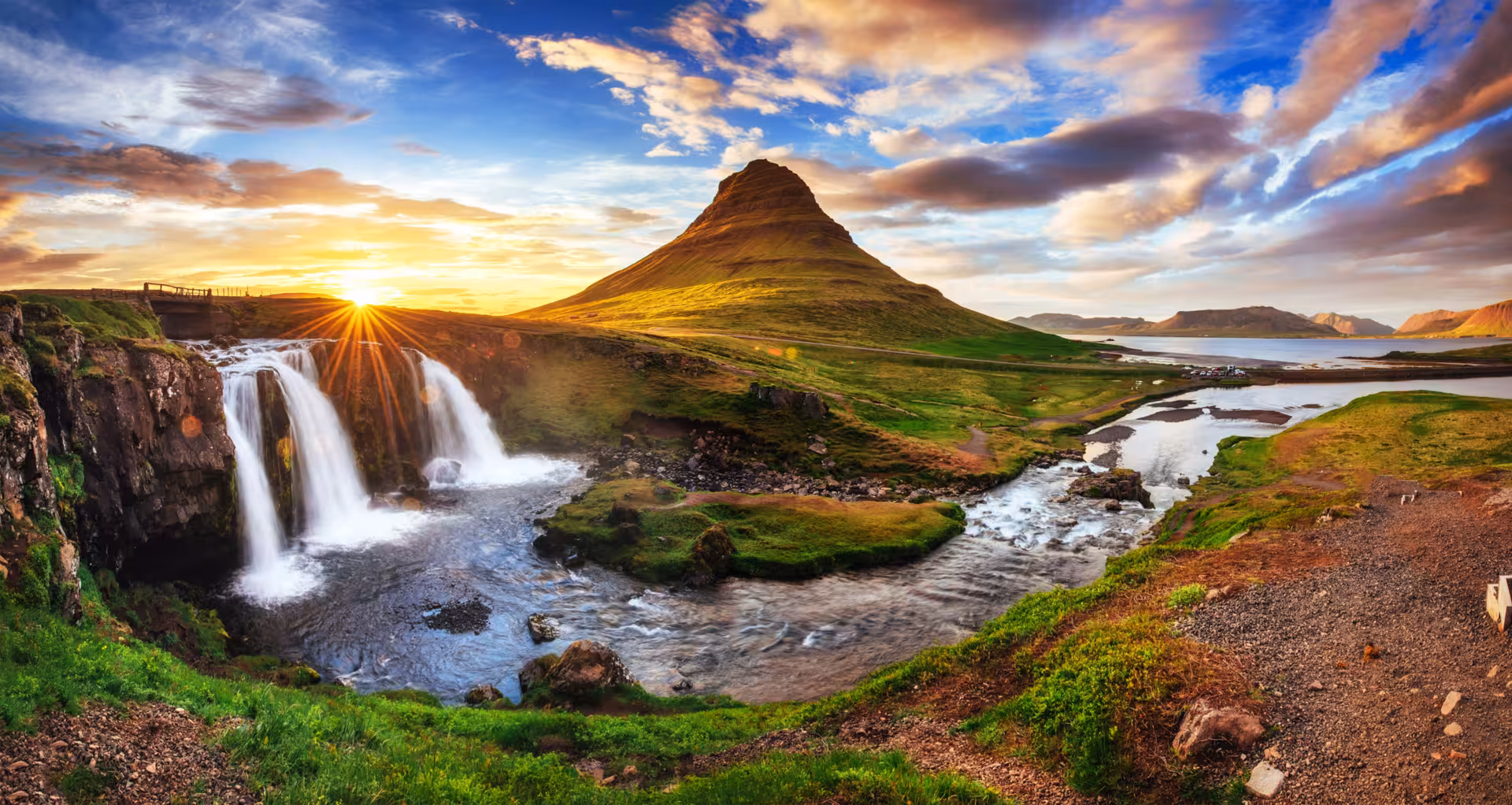 Kirkjufell mountain with Kirkjufellfoss waterfall at sunset on Snaefellsnes Peninsula, Iceland