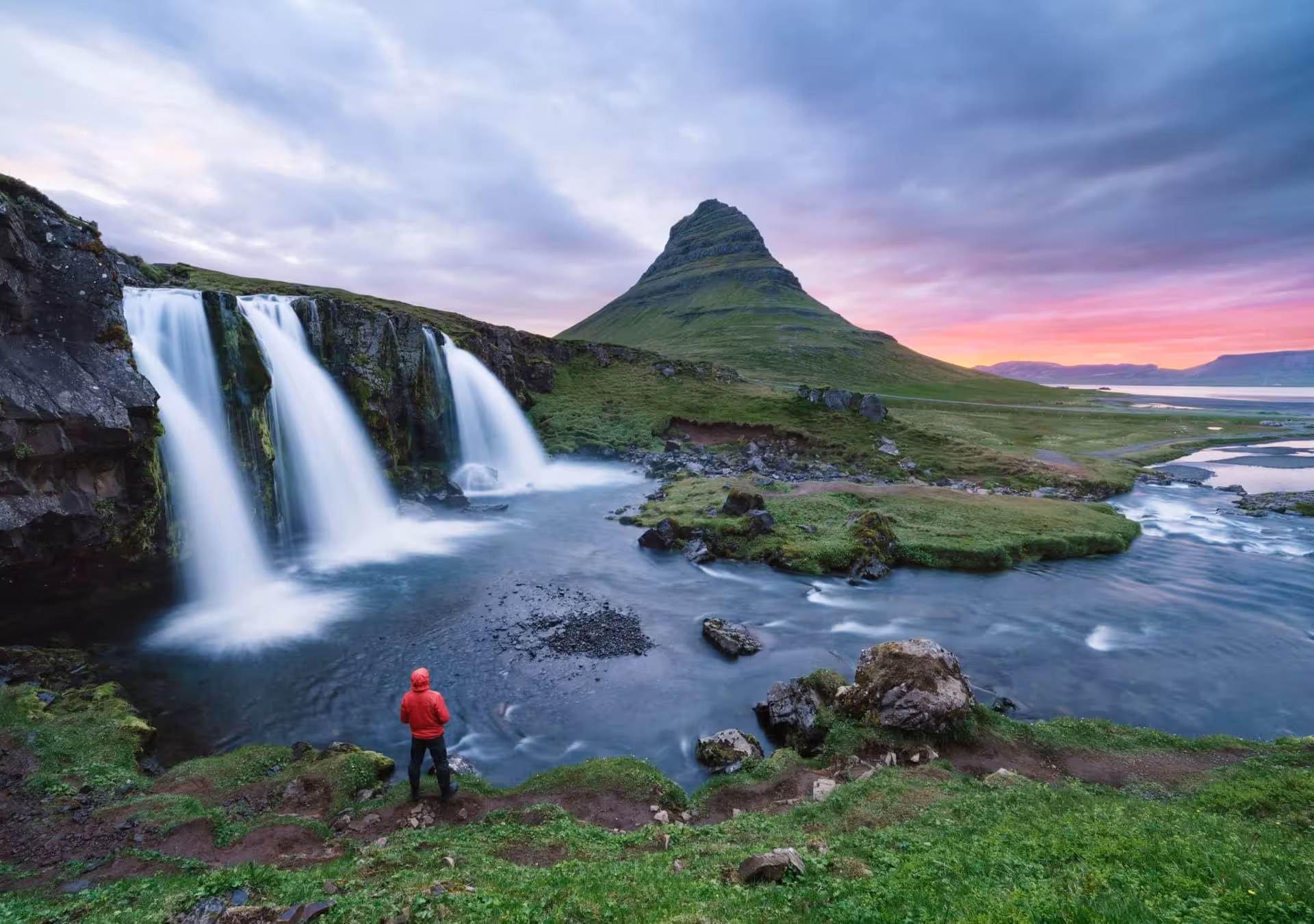 Kirkjufell mountain and Kirkjufellsfoss waterfall at sunset on a Snæfellsnes Peninsula private tour