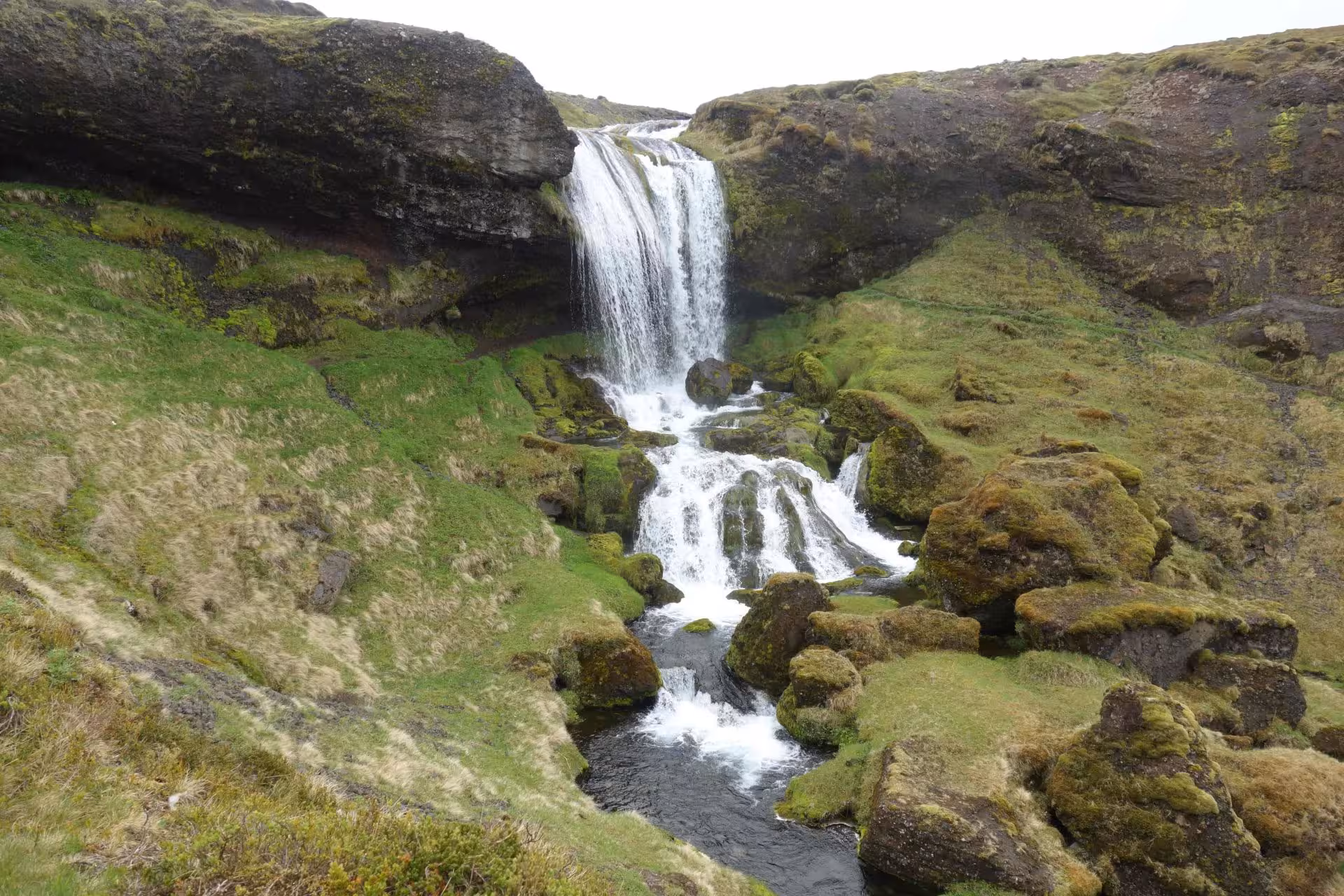 Kirkjufellsfoss waterfall cascading over mossy rocks on a Snæfellsnes Peninsula private full-day tour