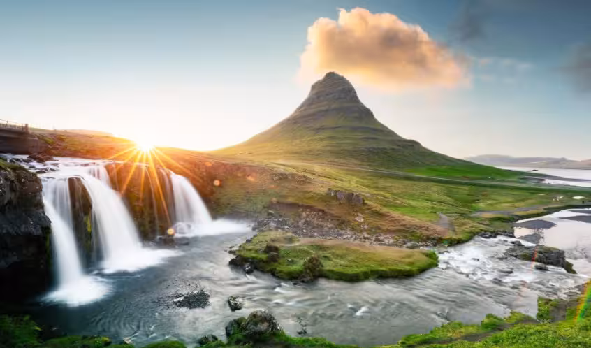 Sunrise at Kirkjufellsfoss waterfall and Kirkjufell mountain on a Snæfellsnes Peninsula private tour from Reykjavik
