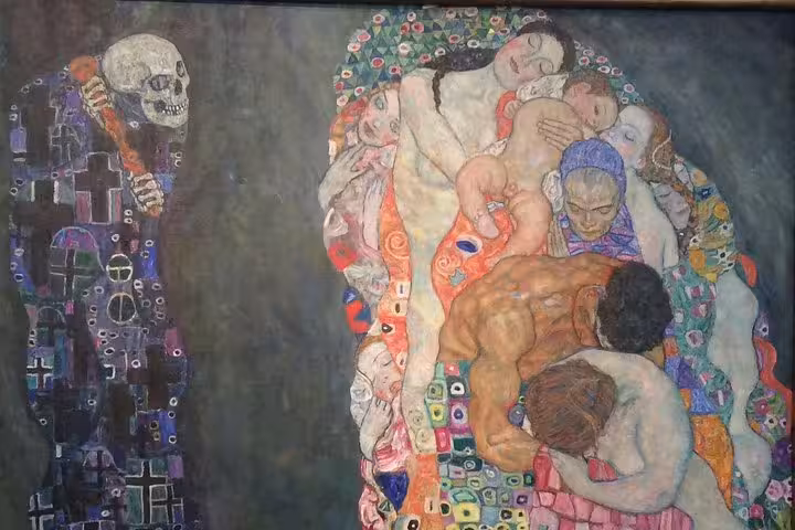Close-up of Gustav Klimt's 'Death and Life' painting highlighting intricate details and vibrant colors at the Leopold Museum.
