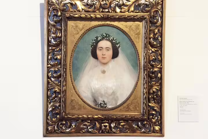 Ornate framed portrait in Belvedere Museum, showcasing Gustav Klimt's detailed artistry for Vienna art tour.