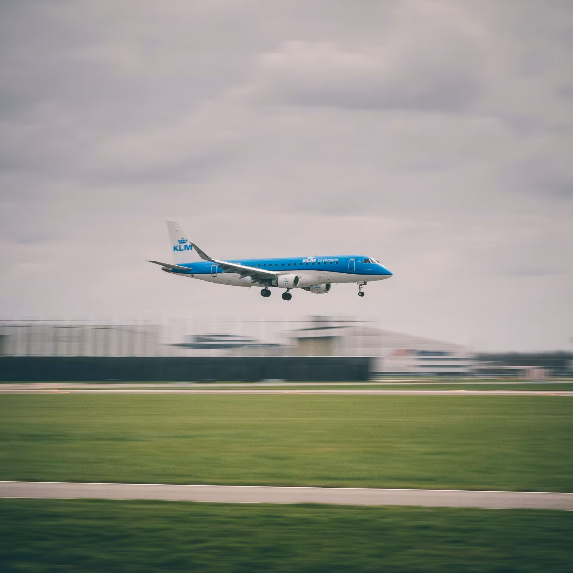 KLM jet landing at Amsterdam Schiphol Airport, gateway for a private 3–5 hour Amsterdam layover city tour